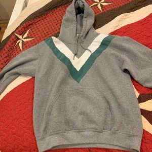 Gray hoodie with green and white stripes.